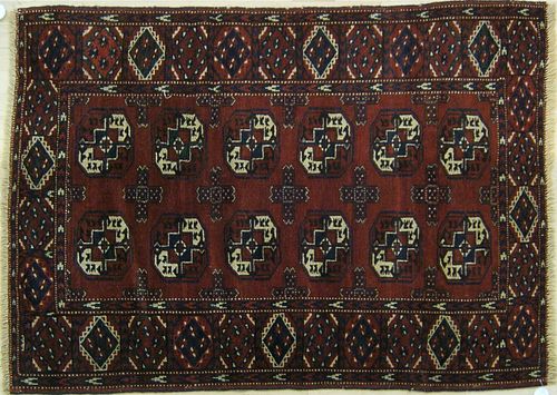 Turkoman throw rug, ca. 1920, with repeating medal
