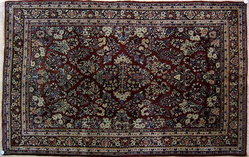 Sarouk throw rug, ca. 1920, with overall floral pa