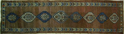 Persian runner, ca. 1920, with 8 medallions on a t