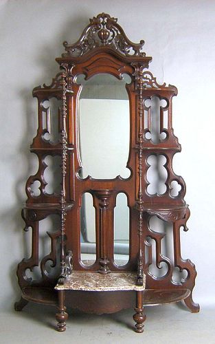 Victorian walnut etagere with scalloped mirror and