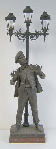 French bronze table lamp depicting a young lad byt