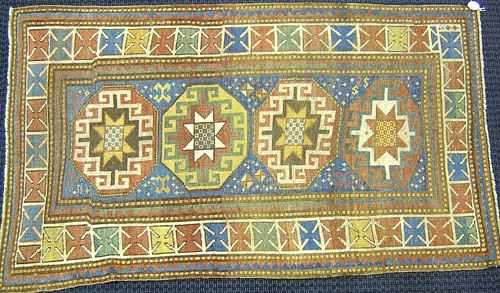 Moghan Kazak throw rug, ca. 1900, with 4 central m