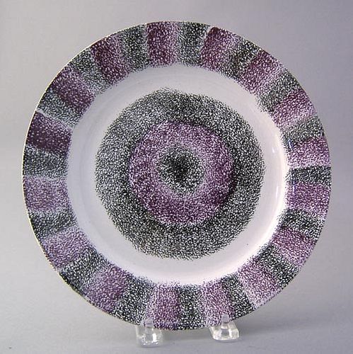 Vibrant black and purple rainbow spatter plate wit