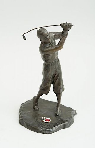 BLACK PATINATED SPELTER FIGURE OF A GOLFER WITH ENAMEL CREST