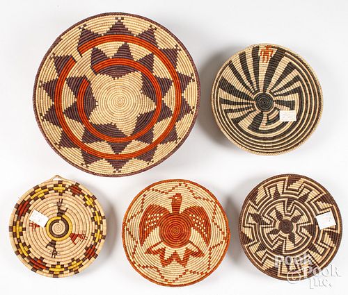 Five Pakistani coiled baskets, late 20th c.