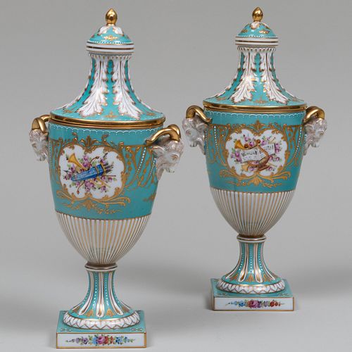 Pair of Sevres Style Turquoise Ground Porcelain Urns and Covers