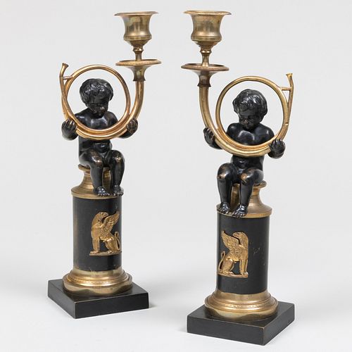 Pair of Continental Gilt-Metal and Patinated-Bronze Figural Candlesticks