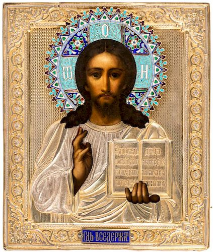 A RUSSIAN ICON OF CHRIST PANTOCRATOR IN A GILT SILVER AND ENAMEL OKLAD, MARKED SG, 1890S