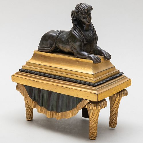 Regency Ormolu and Patinated Bronze Sphinx Form Chenet 