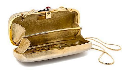 A Judith Leiber Brushed Goldtone Minaudiere, 7" x 3" x 1.5".