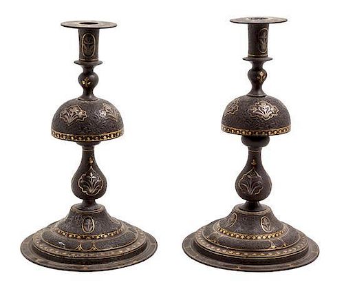 * A Pair of Syrian Metal Inlaid Candlesticks Height 11 inches.