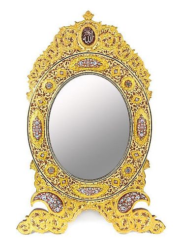 * A Persian Gilt Bronze Mounted and Enameled Table Mirror Height 33 1/4 x width 22 5/8 inches.