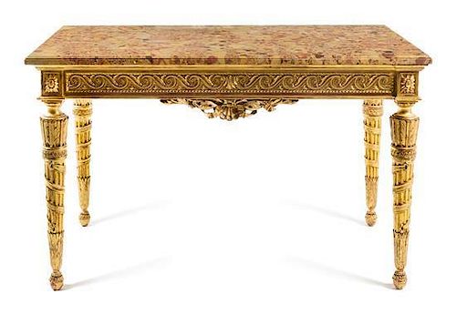 A Louis XVI Style Giltwood Center Table Height 28 3/4 x width 46 1/2 x depth 26 inches.