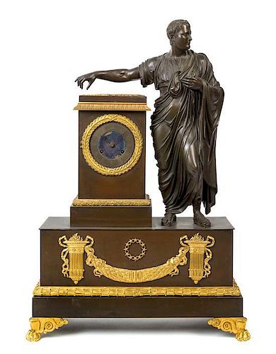 An Empire Style Gilt and Patinated Bronze Figural Mantel Clock Height 26 3/4 inches.