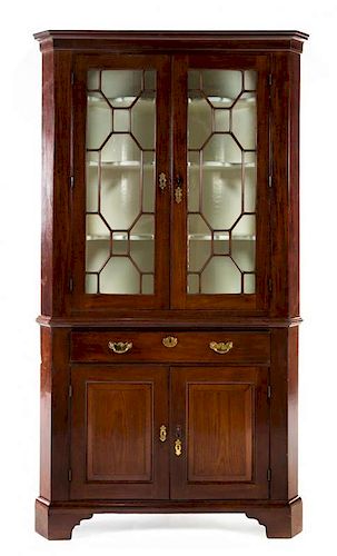 * A George III Style Mahogany Corner Cabinet Height 84 1/4 x width 45 1/2 x depth 29 inches.