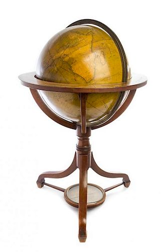 A Regency Mahogany Eighteen-Inch Terrestrial Floor Globe Height 39 x diameter 24 inches.