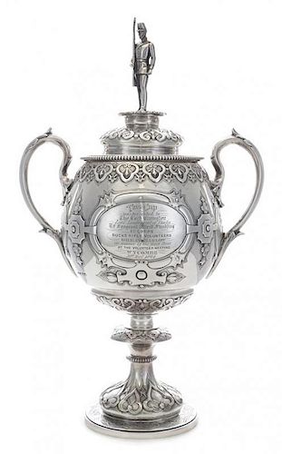 A Victorian Silver Cup and Cover, Edward and John Barnard, London, 1863, the domed lid surmounted by an infantryman, worked t