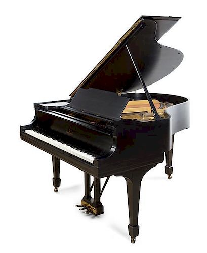 A Steinway & Sons Black Lacquered Baby Grand Piano Width of case 56 inches.