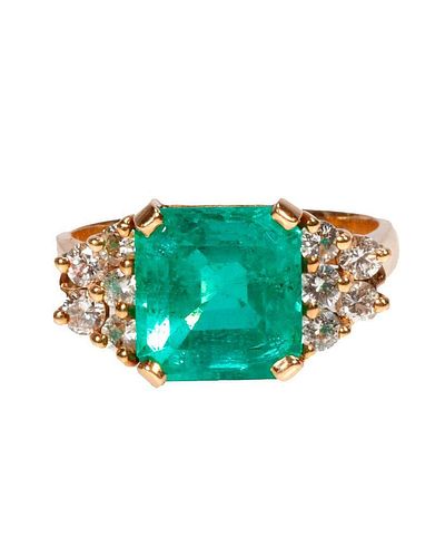 An emerald, diamond and 14k gold ring