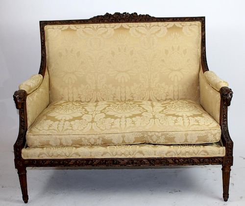 French Louis XVI carved walnut settee with rams heads