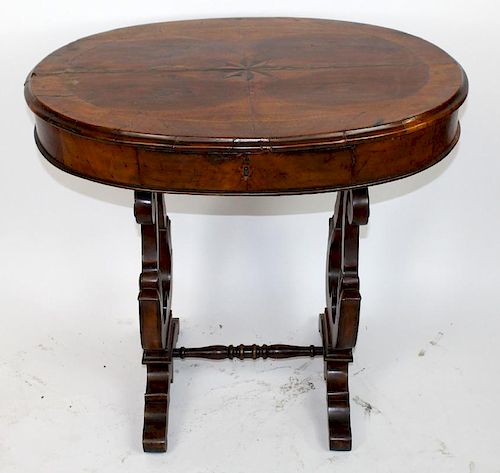 Oval side table with compass rose