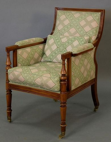 Upholstered occasional chair on brass casters, very clean.