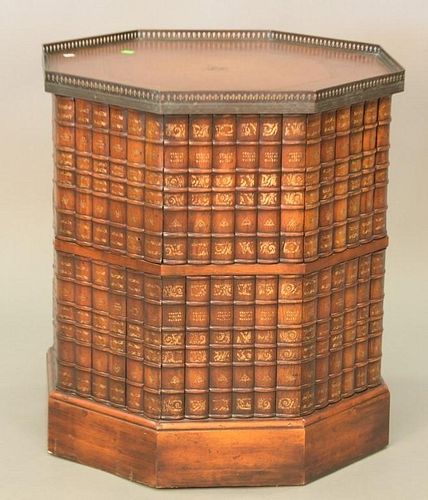 Leather top bar/cabinet with eight sided faux books having one door and brass gallery. ht. 27in., dia. 24in.