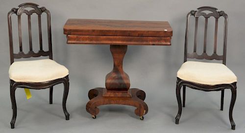 Three piece lot including Empire game table and pair of side chairs. ht. 30in., wd. 34in., dp. 16 1/2in.