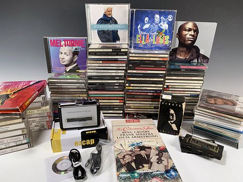 LARGE LOT OF CDS AND TAPES AND CASSETTE CONVERTER