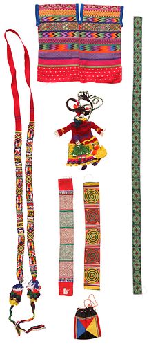 A Group of Seven South American Textiles: comprising a Child's Poncho, an Embroidered Panel, Three Belts, a Coin Purse and a Knitted Figure