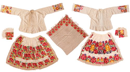 A Group of Seven Guatemalan Embroidered Garments, Including Two Blouses, Two Aprons, a Scarf and Two Caps