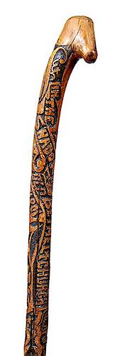 10. Bethel Academy/C.S.A. Folk Art Cane- Ca. 1875- A one-piece carved folk art cane which has high relief carving of “Bethe