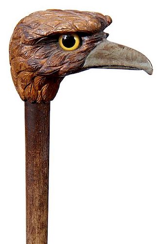 45. Folk Art Bird Cane- Ca. 1925- A carved large bird of prey with two color glass eyes, pyro decoration, painted beak, hardw