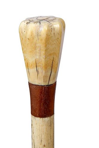 51. Nautical Whalebone Cane- Ca. 1870- A whale’s tooth carved handle which fits to the hand perfectly, coconut wood collar,