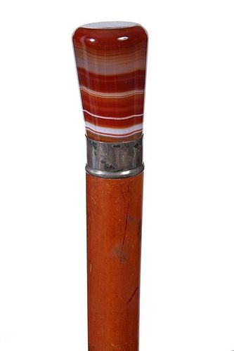 56. Agate Dress Cane- Ca. 1920- A beautiful multi color agate handle which is in fine condition, silver metal collar, thick m