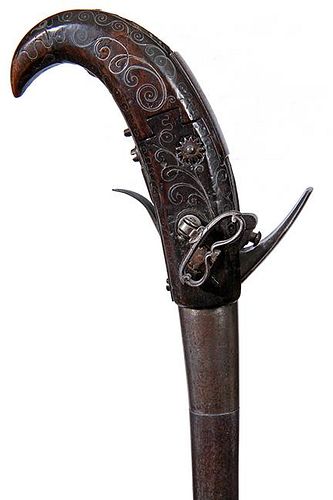 66. Inlaid Silver Gun Cane- Ca. 1850- A most unusual flintlock middle eastern gun cane, the gun can be loaded, completely clo