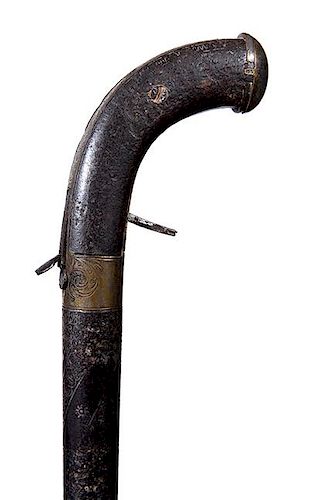70. Gun/Sword Cane- Ca. 1830- A most unusual percussion pistol cane inlaid silver barrel and an engraved tang and butt plate,