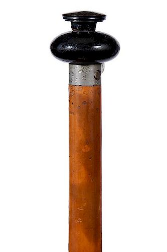 71. Gun Cane- Ca. 1885- A needle fire gun cane with a horn handle which is about a 20 caliber, the shaft separates to load th