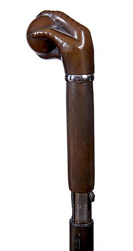 75. Remington Gun Cane- Ca. 1860 – The Remington ball and claw black powder gun cane in working condition, small nickel col