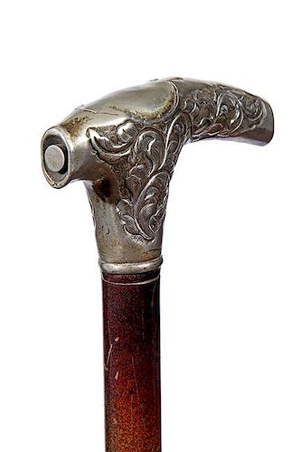 138. Reptile Gig System Cane- Ca. 1890- A most unusual silver handle with a compartment atop that holds a three prong speared