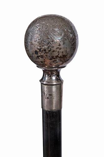 205. Sterling Dress Cane – Dated 1903 – A large signed sterling ball which is half engraved with flowers and leaves which