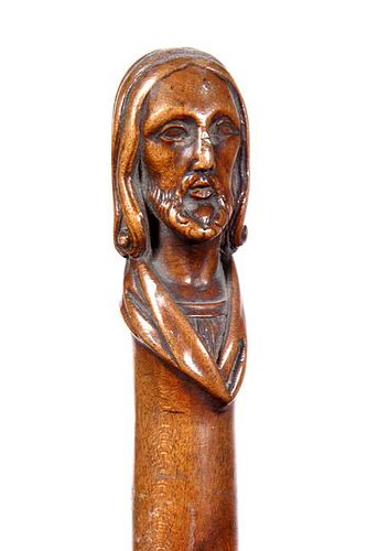 253. Apostle Cane – Ca. 1880 – A carved one-piece hardwood shaft with what appears to be a religious figure atop, origina
