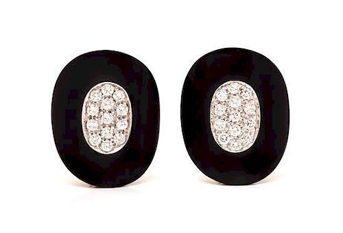 A Pair of 18 Karat Yellow Gold, Onyx and Diamond Earclips, 22.00 dwts.