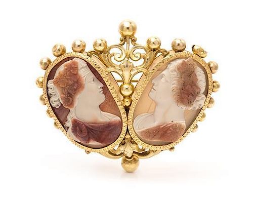 An 18 Karat Yellow Gold, Silver and Double Carved Agate Cameo Brooch, 23.90 dwts.