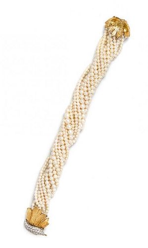 A Bicolor Gold, Diamond and Multistrand Cultured Pearl Torsade Bracelet, 36.20 dwts.