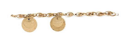 * A 14 Karat Yellow Gold Charm Bracelet with Two Attached Charms, 20.80 dwts.