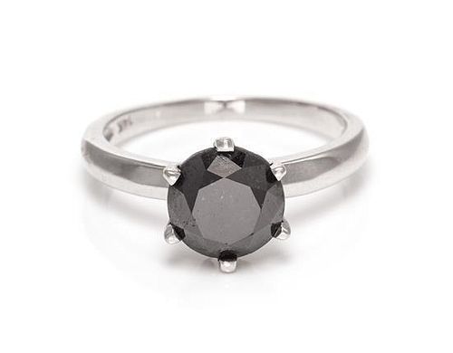 A 14 Karat White Gold and Black Diamond Solitaire Ring, 2.20 dwts.
