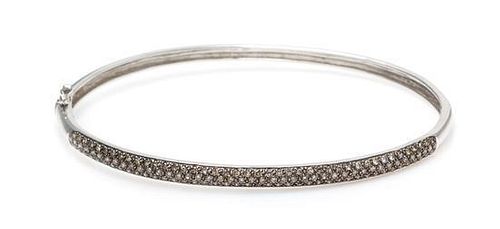 A 14 Karat White Gold and Colored Diamond Bracelet, 6.40 dwts.
