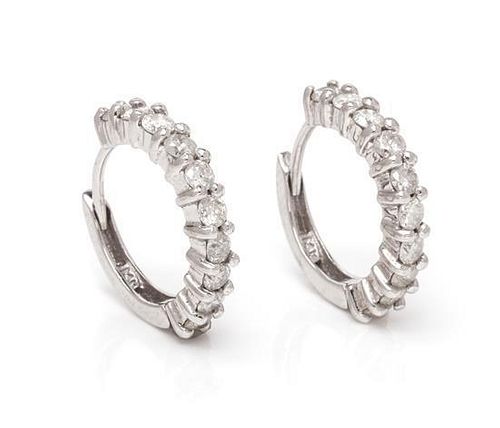 A Pair of 14 Karat White Gold and Diamond Hoop Earrings, 2.20 dwts.