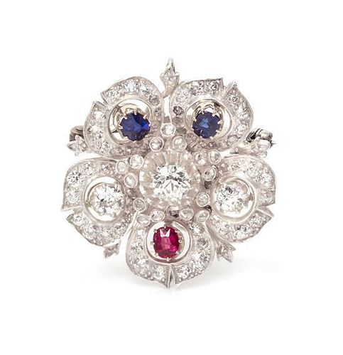 A Silver Topped Gold, Diamond, Ruby and Sapphire Flower Motif Pendant/Brooch, 8.90 dwts.